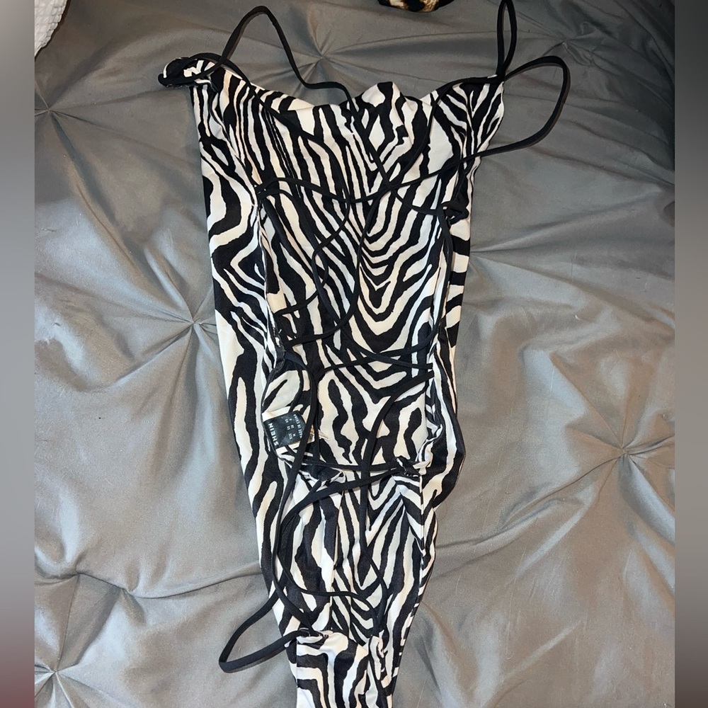 Zebra print, cris cross back, bodysuit